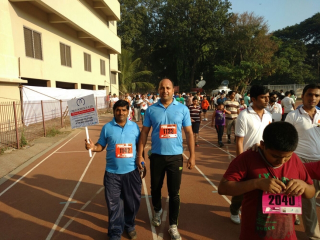 Om Logistics's team runs in Pune Marathon